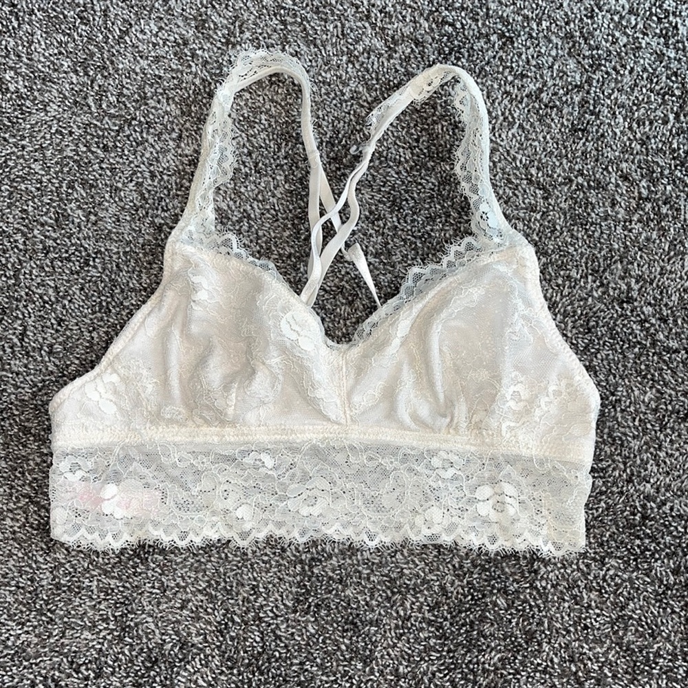 Cream lace bralette with criss cross straps in back size large
